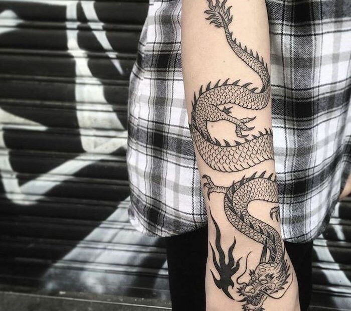 Forearm-Tattoo-Chinese-Dragon-Tattoo-Woman-Wearing-Black-White-Shirt-Black-Pants  | Dragon Tattoo Forearm, Chinese Dragon Tattoos, Dragon Tattoo