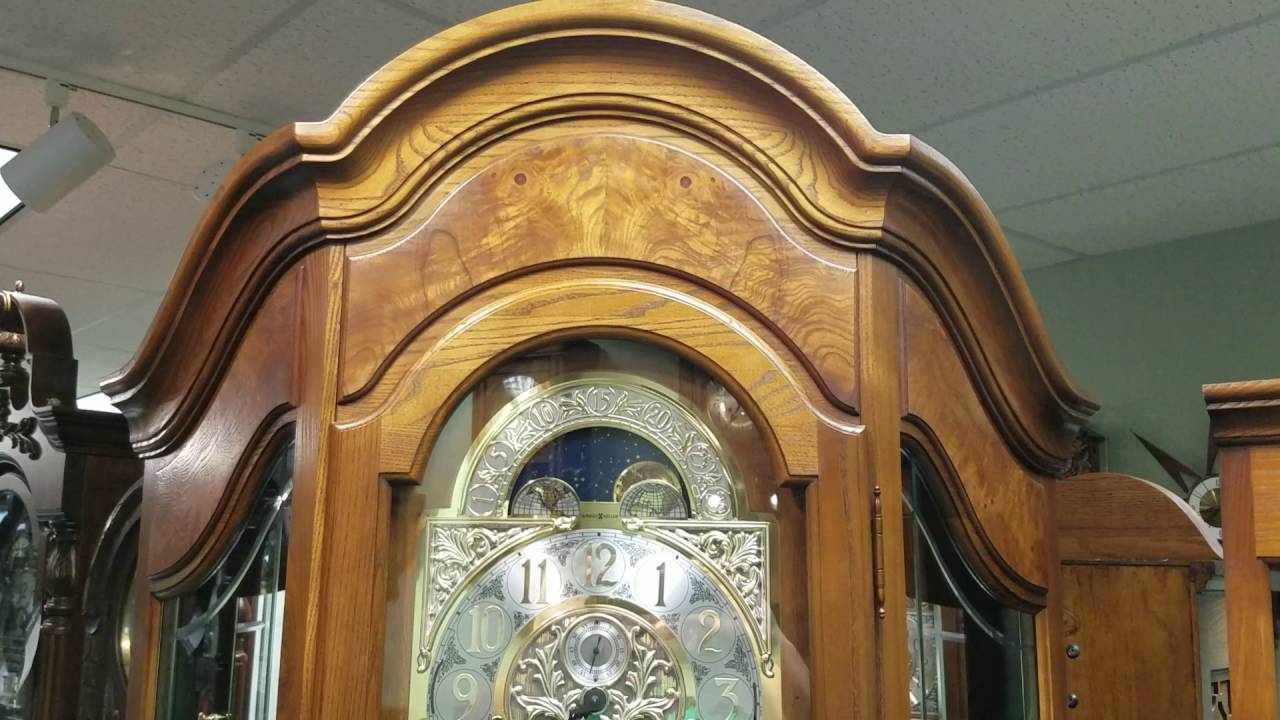 Howard Miller Grandfather Clock With Glass Shelves